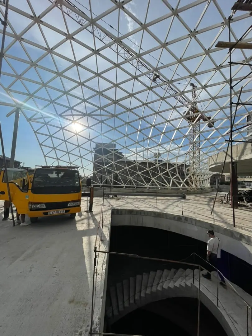 Inside the DOMAINE gridshell, the triangulated grid overhead