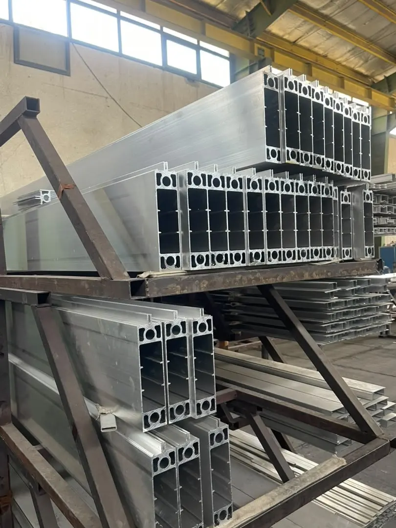 Aluminium profiles produced for DOMAINE, racked in the workshop