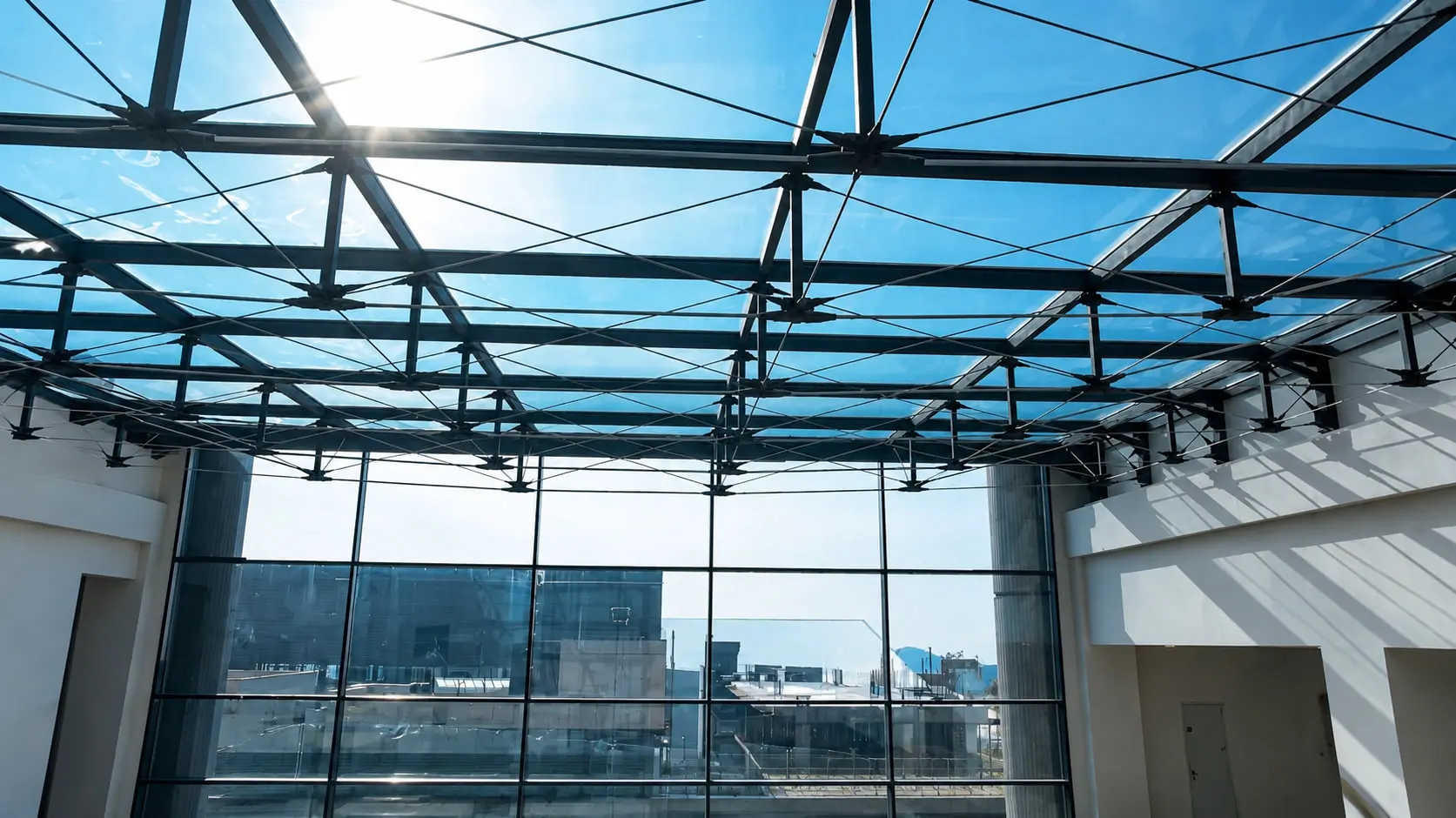 Fanap Campus Complex, Tehran — a pre-tensioned cable truss skylight meeting the curtain wall at the end of a courtyard