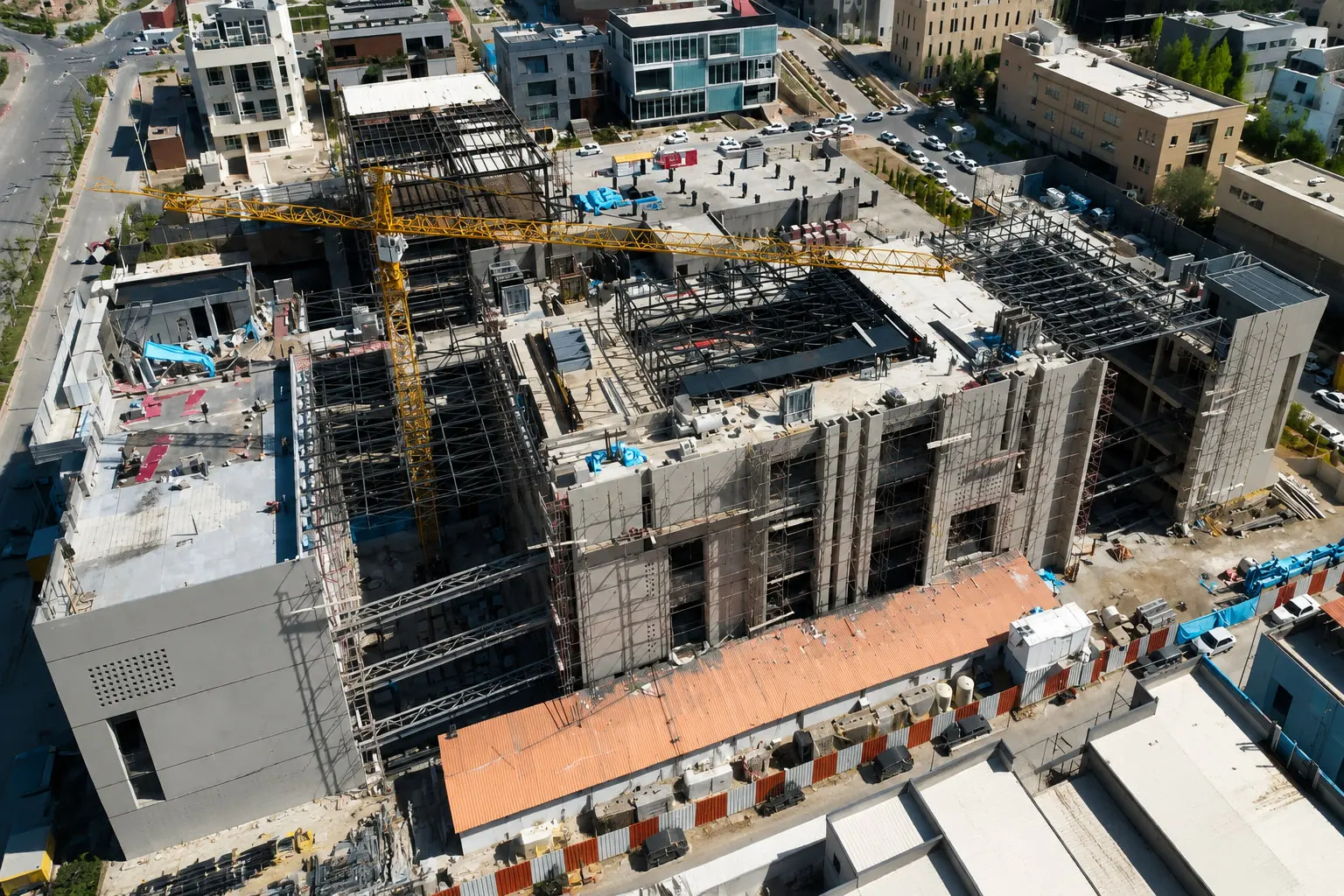 The Fanap campus under construction, tower cranes over the rising blocks