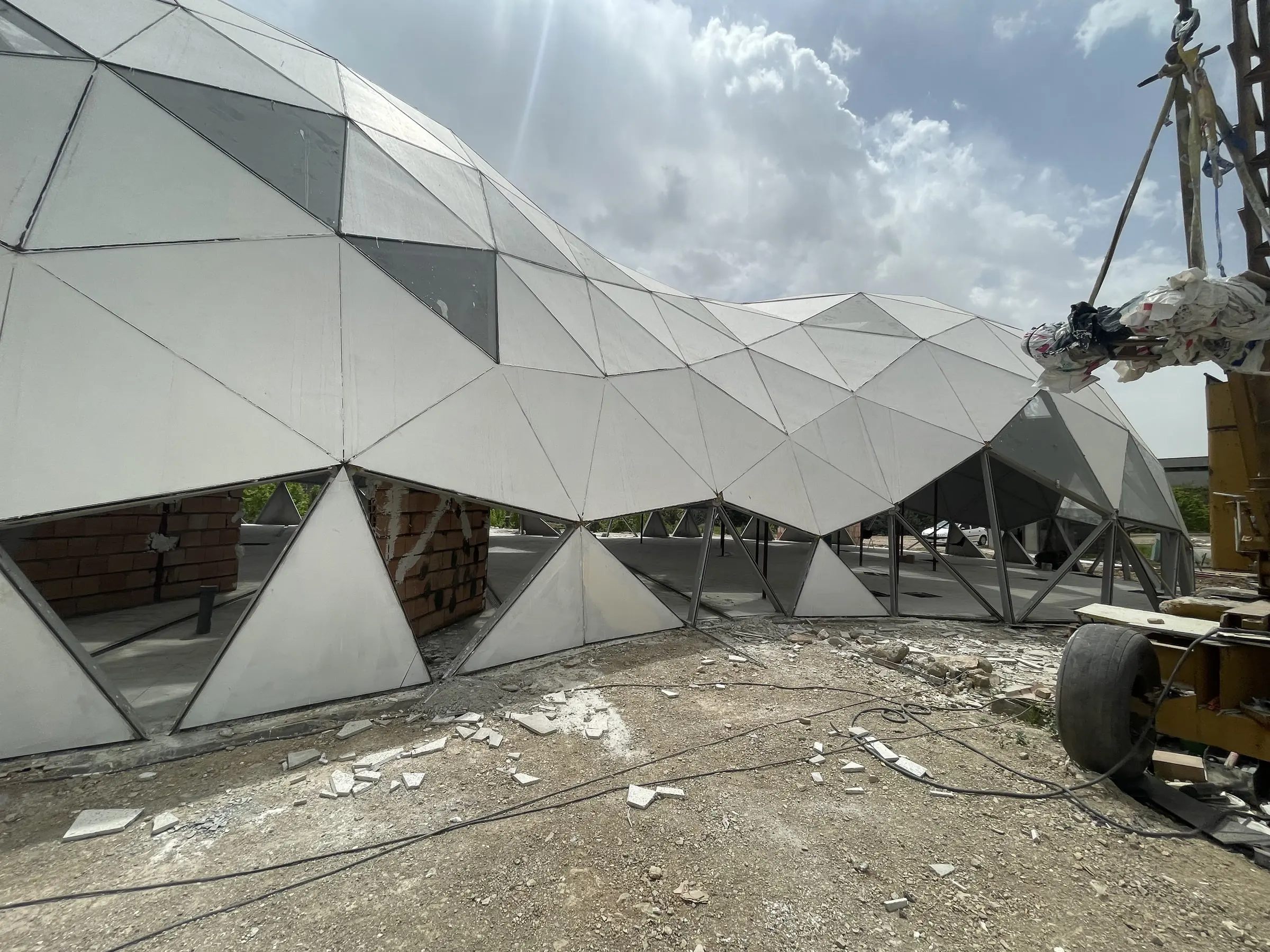 The clad dome from the works compound, panels complete over the lower shell