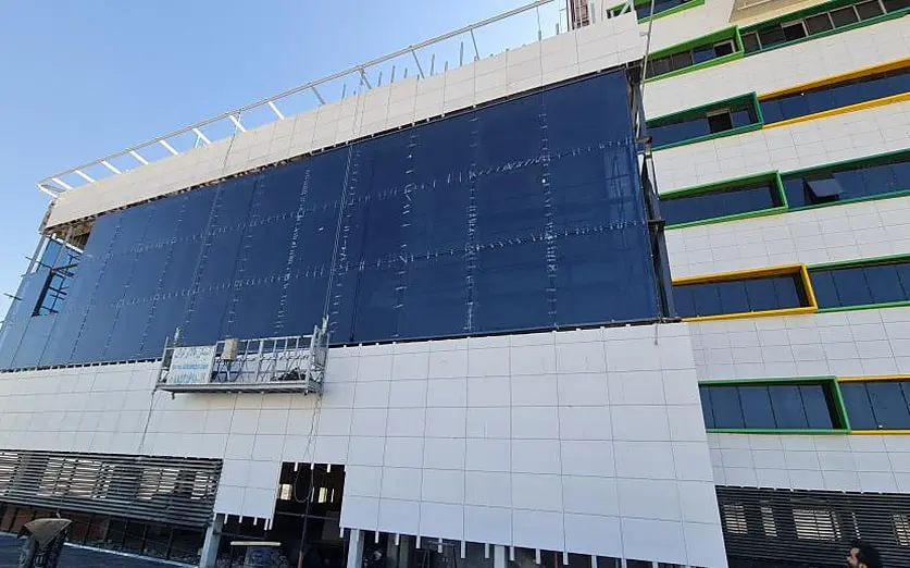 Façade installation in progress on the Noor Hospital elevation