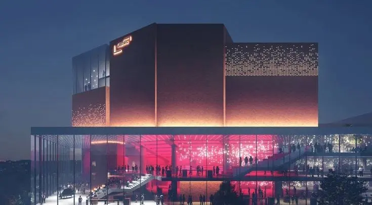 Reference image: a building at dusk with perforated metal panels lit from behind