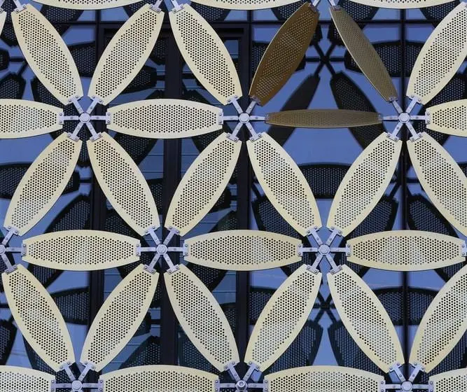 Reference example 6 of perforated metal dry façade — punched metal screens and second skins