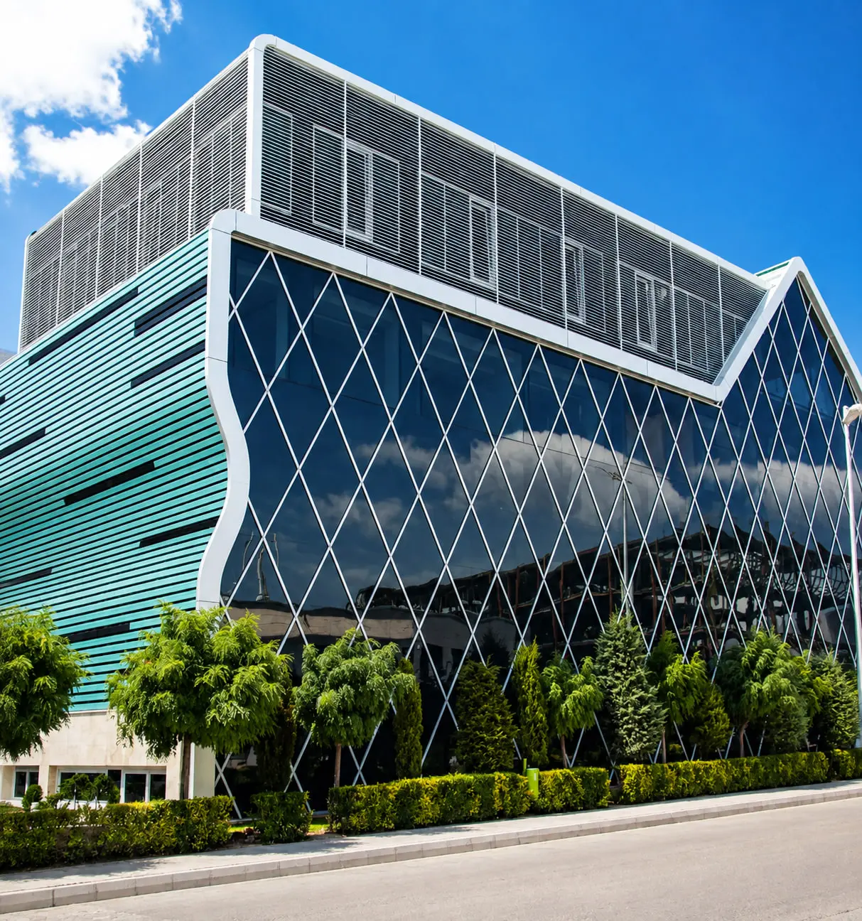 Sobhan Biotech at the corner, the diamond-patterned glazing and its teal tint in daylight
