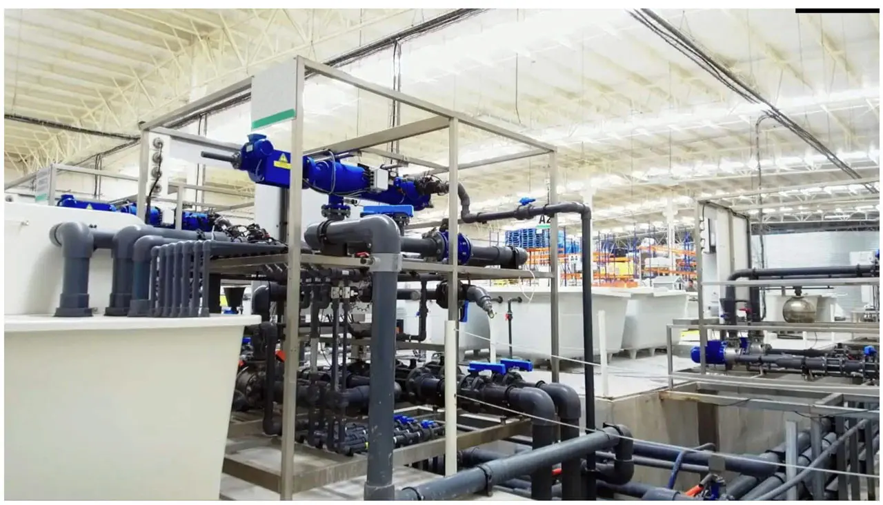 Greenhouse water treatment plant with filtration vessels, manifolds and storage tanks