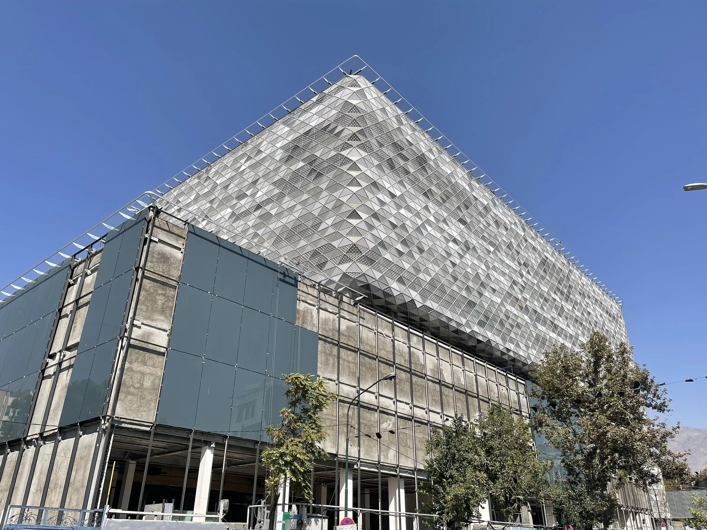 Yas Shopping Mall at the corner, the folded metal skin over the glazed lower floors